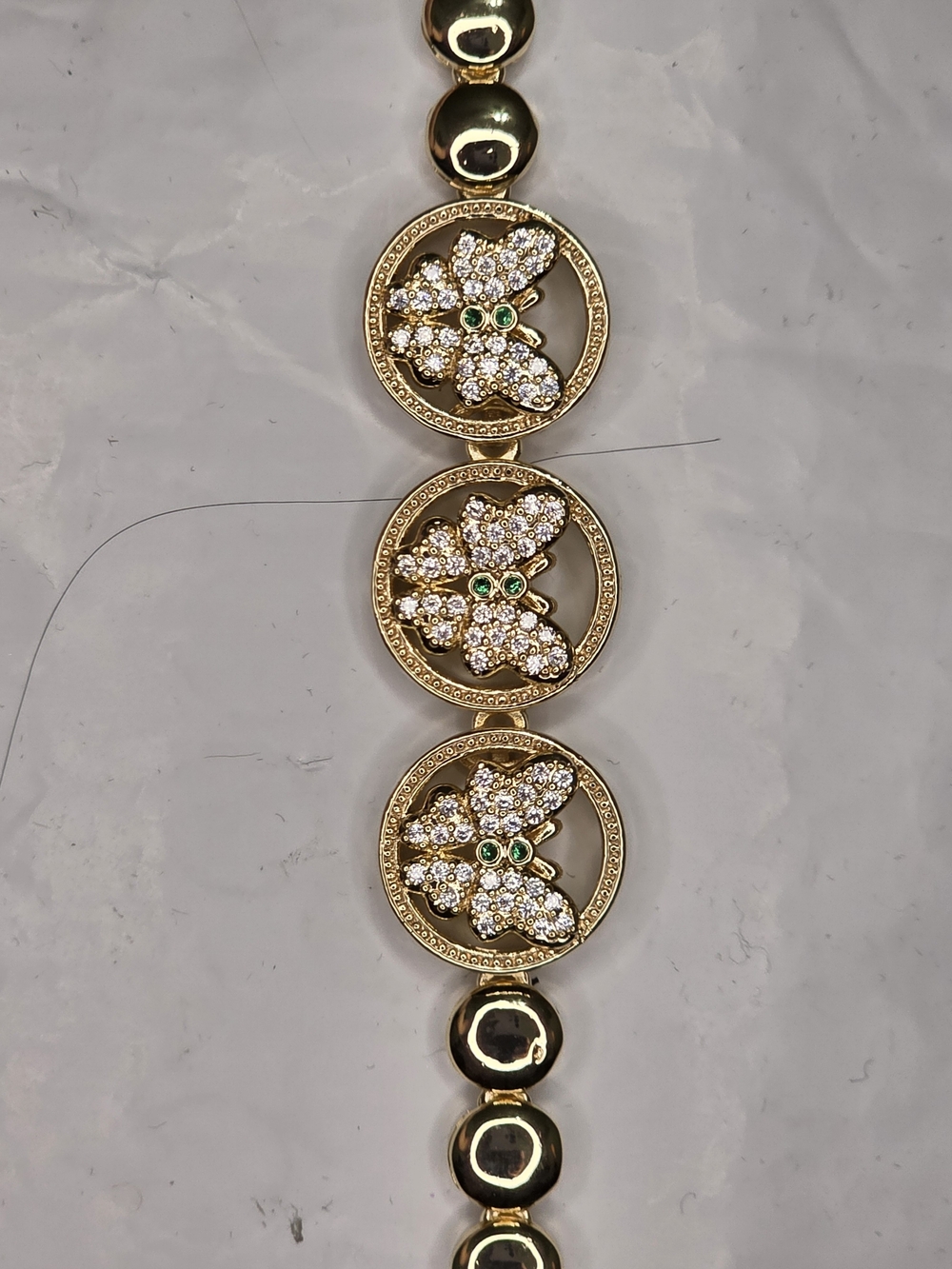 Gold-Tone Floral Crystal Bracelet with Green Accents